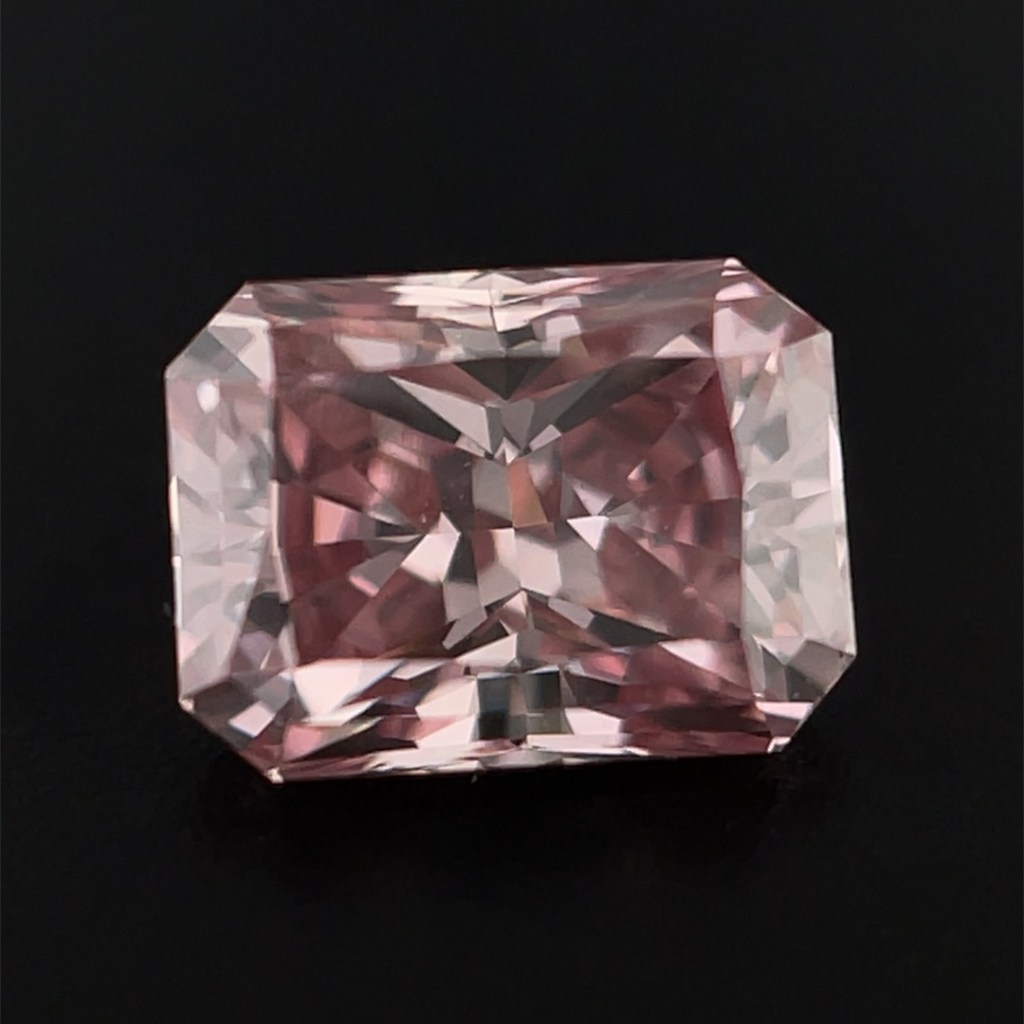 Argyle pink diamond on a black background