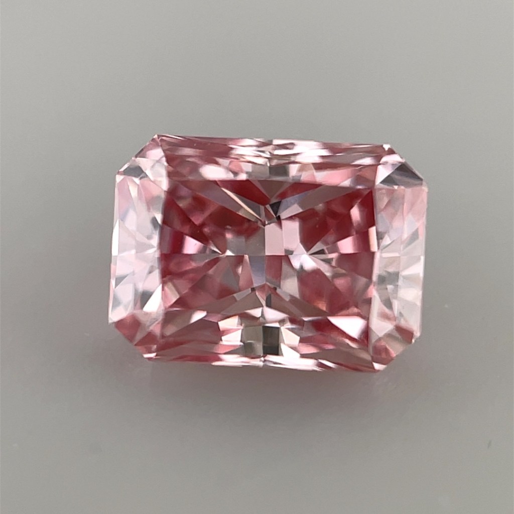 Argyle pink diamond on a grey background